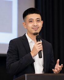 Speaking at the podium